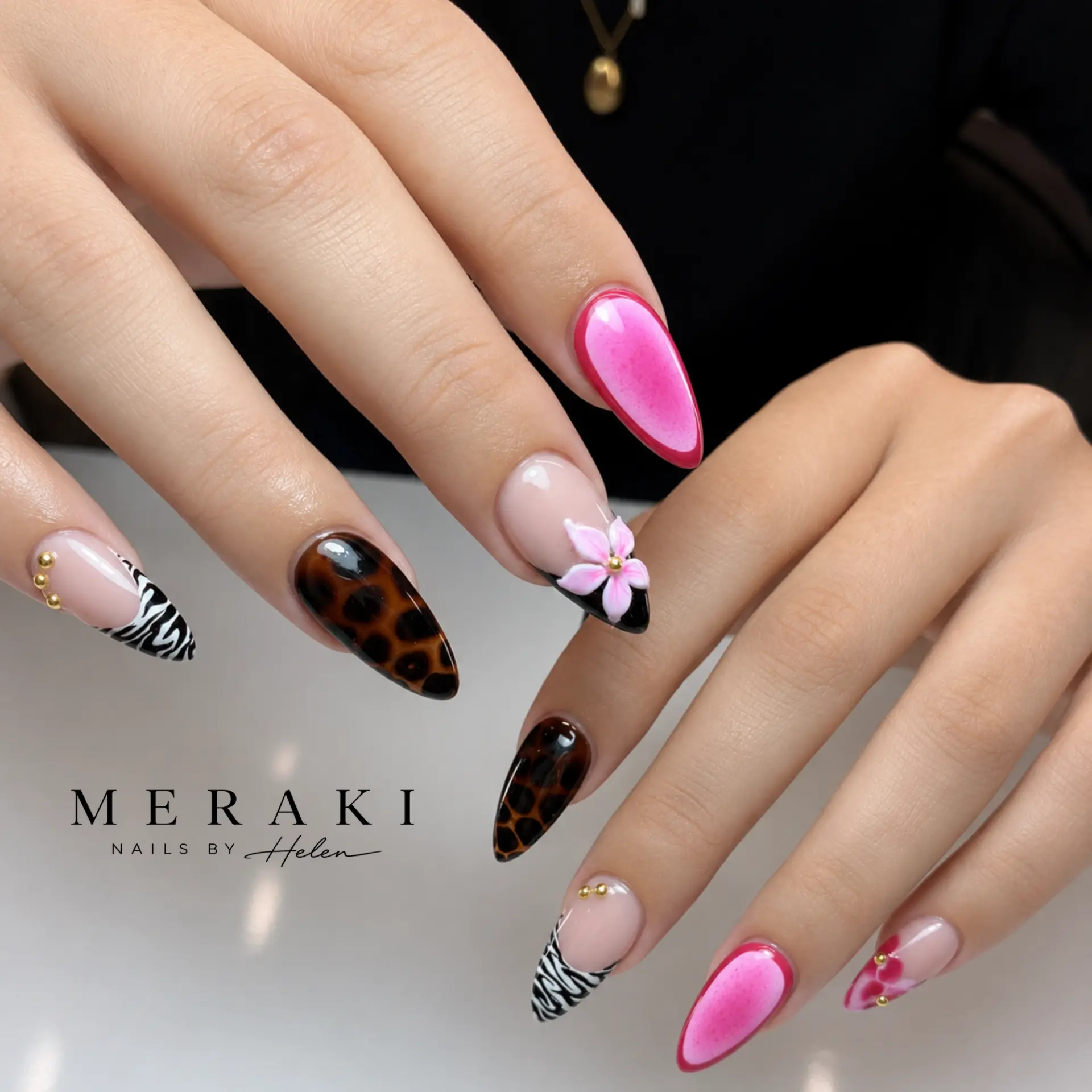 Pink, leopard and zebra print almond nails with a 3D flower