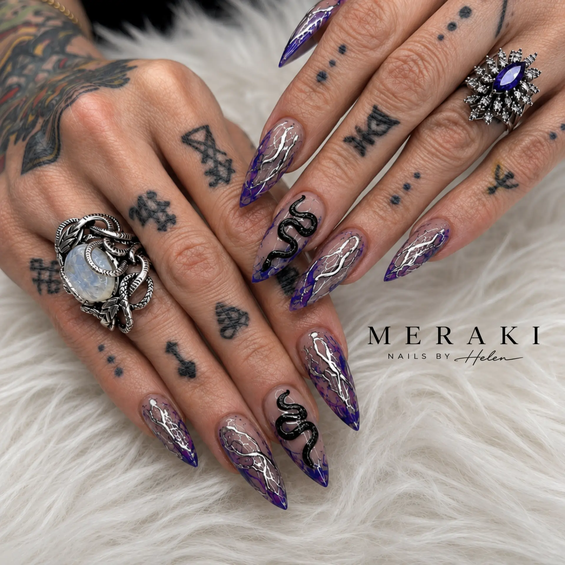 Purple and smoke stiletto nails with 3D black snake art